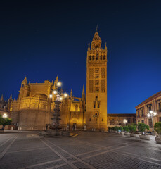 Wall Mural - Seville Cathedral at Plaza Virgen de Los Reyes Square at night - Seville, Andalusia, Spain