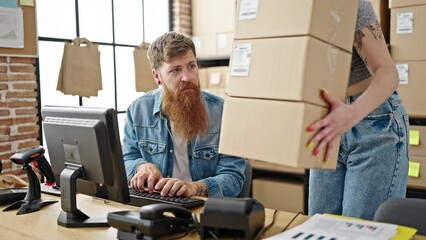 Sticker - Man and woman ecommerce business workers using computer holding packages at office