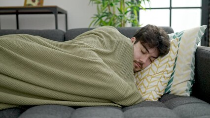 Sticker - Young hispanic man lying on sofa sleeping at home