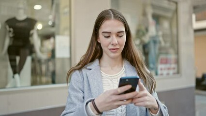 Poster - Young hispanic woman using smartphone recording video at street