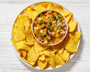 Sticker - summer fruit salsa with tortilla chips on plate