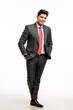 © Niks Ads - Young indian businessman in classic suit giving expression.