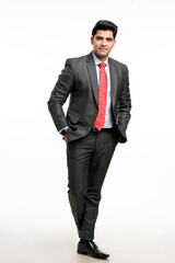 Wall Mural - Young indian businessman in classic suit giving expression.