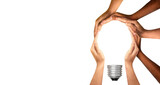 Symbols and shapes of light bulbs created by hand. People thinking together and team ideas coming together joining hands. The concept of idea, cooperation, teamwork and creative solution.