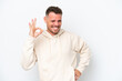 Young caucasian handsome man isolated on white background showing ok sign with fingers