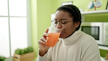 Canvas Print - African american woman drinking orange juice suffering for teeth pain at dinning room