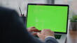 © stockbusters - Entrepreneur typing mockup laptop at office close up. Manager using green screen