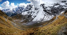 Stelvio Pass with snowy mountains in the background in Switzerland