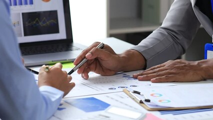 Wall Mural - Finance workers are working together to prepare company financial documents for the meeting with management, together they are checking the accuracy of the information. Financial concept.