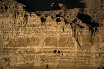 Sticker - Brown cliff wall. Earth forest landform in Zanda County, Tibet, China.