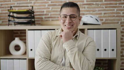 Sticker - Young hispanic man business worker standing with arms crossed gesture at office