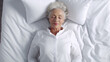 elderly woman in bed, top view, early morning in daylight, getting up or staying in bed