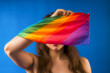 Expressive Generative AI pride photo of a lesbian woman with rainbow flag patterns. Inclusive society with equal rights. Pride day month celebration of diversity and inclusion.
