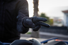 Close-up Of A Biker's Hands Showing The Hand Gestore Of Salute, The V Gesture