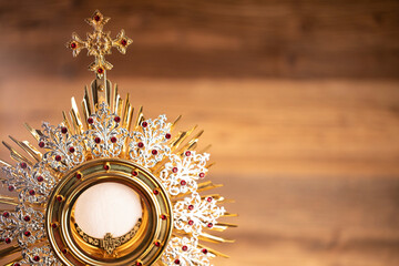 Wall Mural - Catholic religion concept. First Holy Eucharist.The monstrance.