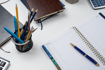 Poster - Laptop, blank notepad, pen calculator, reminder  flower on office table