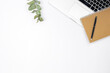 © puhimec - Minimalistic white background with laptop, notepad and pen, top view.