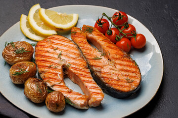 Wall Mural - Grilled salmon steaks and potatoes