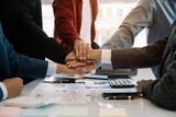 Fototapeta  - Group of diverse business people discussing a project in a meeting for analysis graph company financial.