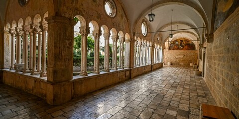 Poster - Tiled floor and arch stone wall inside Franciscan Church and Monastery in Dubrovnik, Croatia