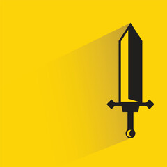 Wall Mural - sword with shadow on yellow background