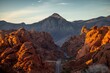 © Randal Finklea/Wirestock Creators - Aerial landscape of a highway road through a desert at sunrise at Valley of Fire