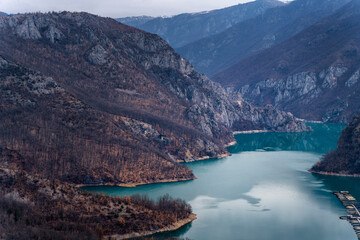 Wall Mural - Beautiful mountain landscape, lake with blue water in the gorge in spring. Canyon Piva Pluzhine, travel to Montenegro