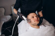 © Roman - Face cryomassage, caucasian man. Skin cryotherapy close up. Liquid nitrogen use in medicine