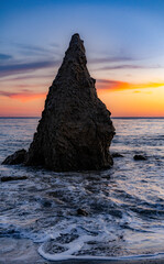 Sunset by the ocean at El Matador Beach, Malibu, California.