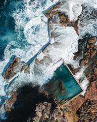 Wall Mural - north curl curl rock pool with incoming waves.