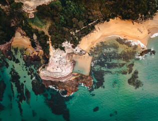 Wall Mural - aerial drone shot of aslings beach rock pool in eden, new south wales, australia.