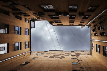 Wall Mural - Inner courtyard perspective, old yellow residential houses