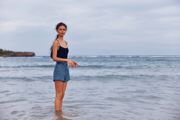 travel woman running beach sunset sea lifestyle happy summer young smile