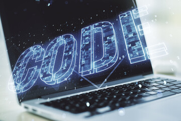 Wall Mural - creative code word sign on modern computer background, international software development concept. m