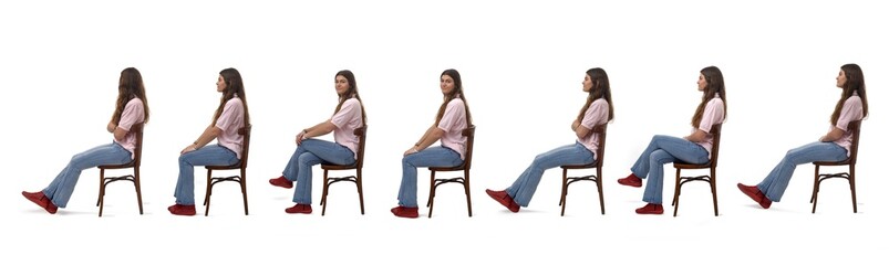 Wall Mural - Side view of a group of same  young girl sitting on chair on white background