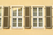 © Pixel-Shot - View of residential building with white windows and shutters