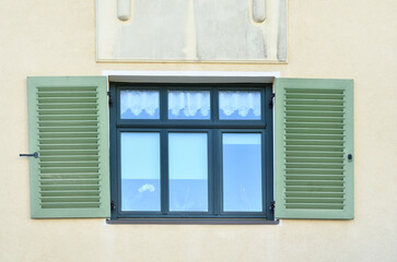 Sticker - View of residential building with wooden window and shutters