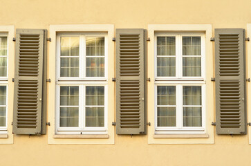 Wall Mural - View of residential building with white windows and shutters