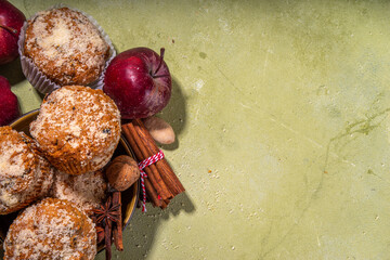 Wall Mural - Apple pie crumble streusel muffins, Sweet autumn baking pastry with red apple slices, cinnamon and spices and crumble toppings