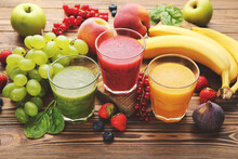 Healthy Smoothie In Glasses With Fruits And Vegetable On Wooden Background