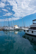 Moderm yachts moored in marina. Calm water and reflection. Vacation and tourism concept 

