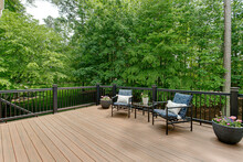 Beautiful Summer Staged Deck With Nature Woods And A Flower Pot