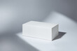 © runrun2 - White paper box mockup in sunlight with shadow on white background.