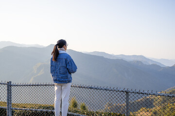 Sticker - Travel woman enjoy the scenery view over the mountain