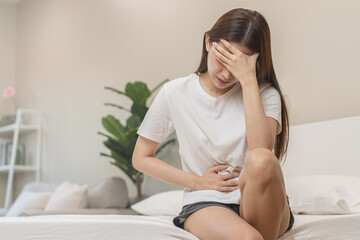 flatulence ulcer, asian young woman, girl hands in belly, stomachache from food poisoning, abdominal