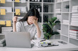 © NINENII - Concept of business failure Working female are under stress from working.