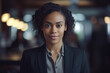 © Roman - Bllack woman in a business suit standing in a confident pose. Woman's rights equality success of African-American people generative ai
