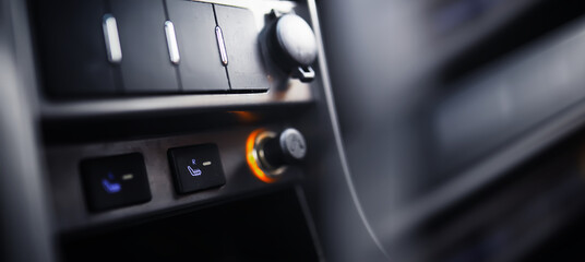  The process of choosing climate control in the car. Various controls in auto switches. Modern car interior