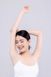 Beautiful Young Asian woman lifting hands up to show off clean and hygienic armpits and underarms isolated, Smooth armpit concept.