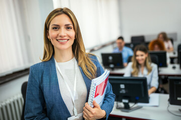 Educator and students in programming school
